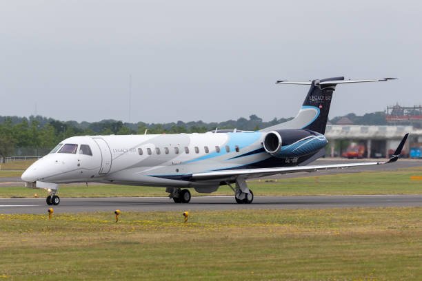 Farnborough, UK - July 20, 2014: Embraer EMB-135BJ Legacy 600 business jet aircraft OE-IBK on the runway at Farnborough Airport.